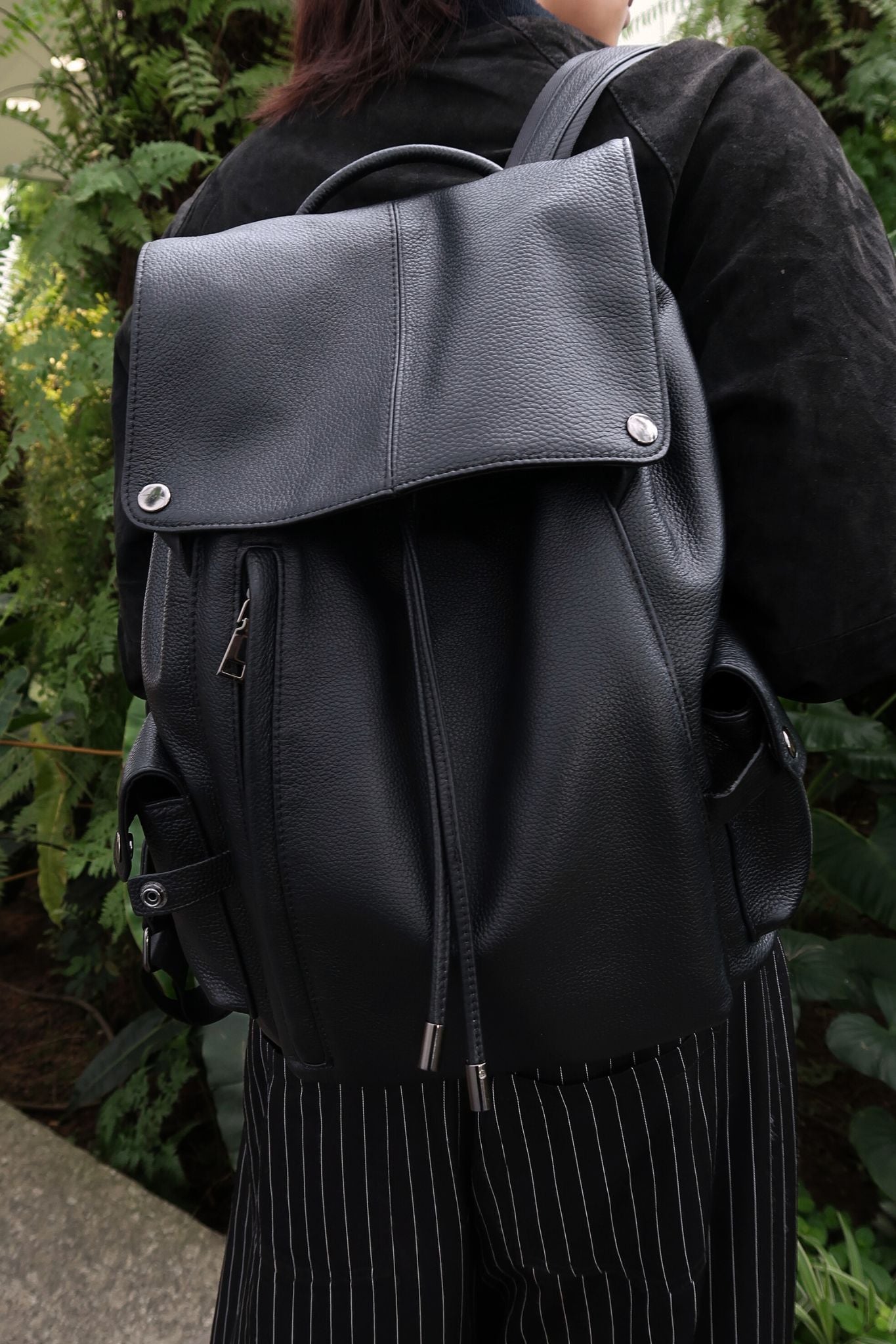 Unisex cowhide leather backpack Drawstring flap design