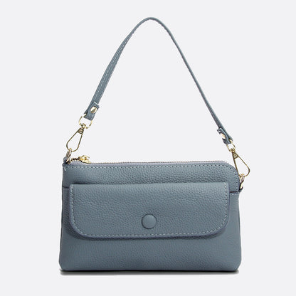 Women's cowhide leather clutch bag Button design