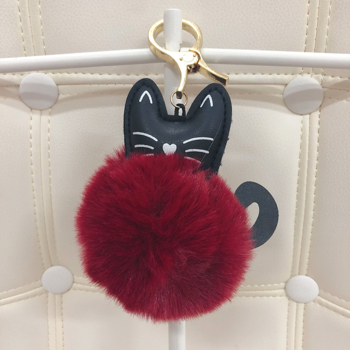 Cat with fur ball bag charm by Tomorrow Closet