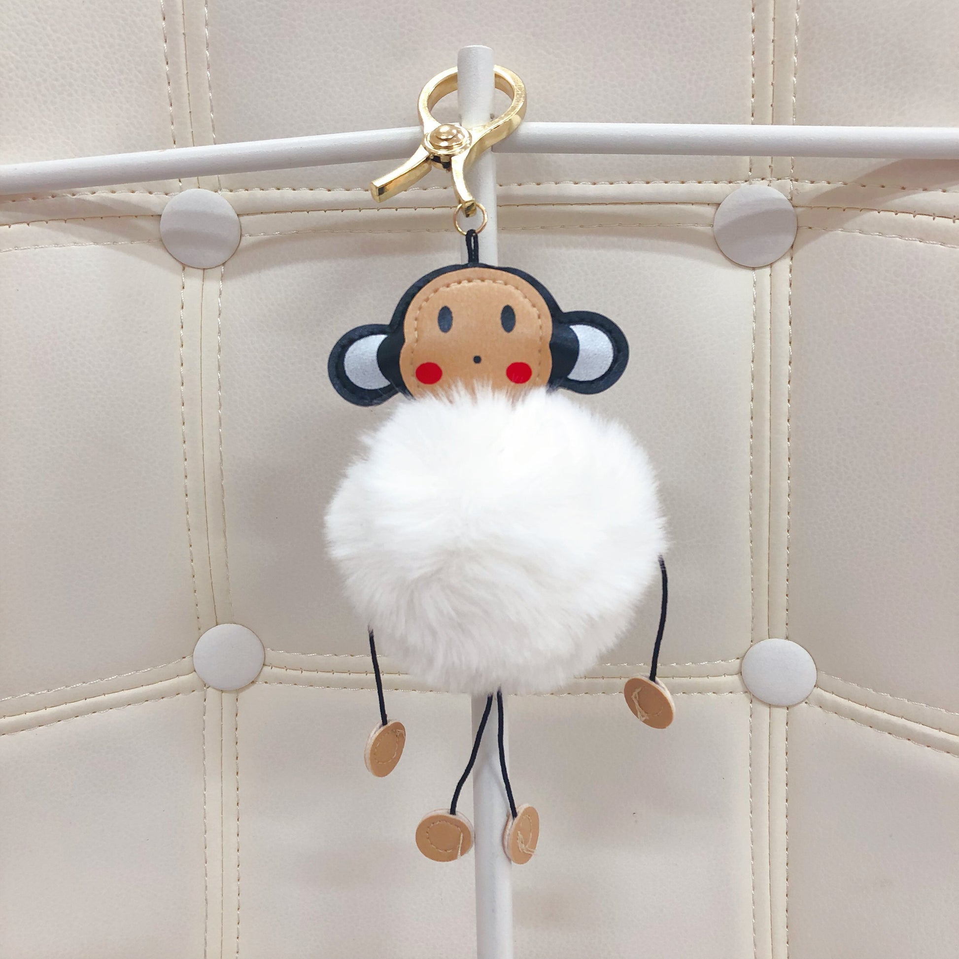 Monkey with fur ball bag charm by Tomorrow Closet