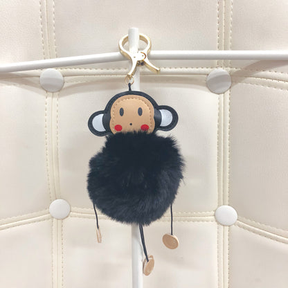 Monkey with fur ball bag charm by Tomorrow Closet